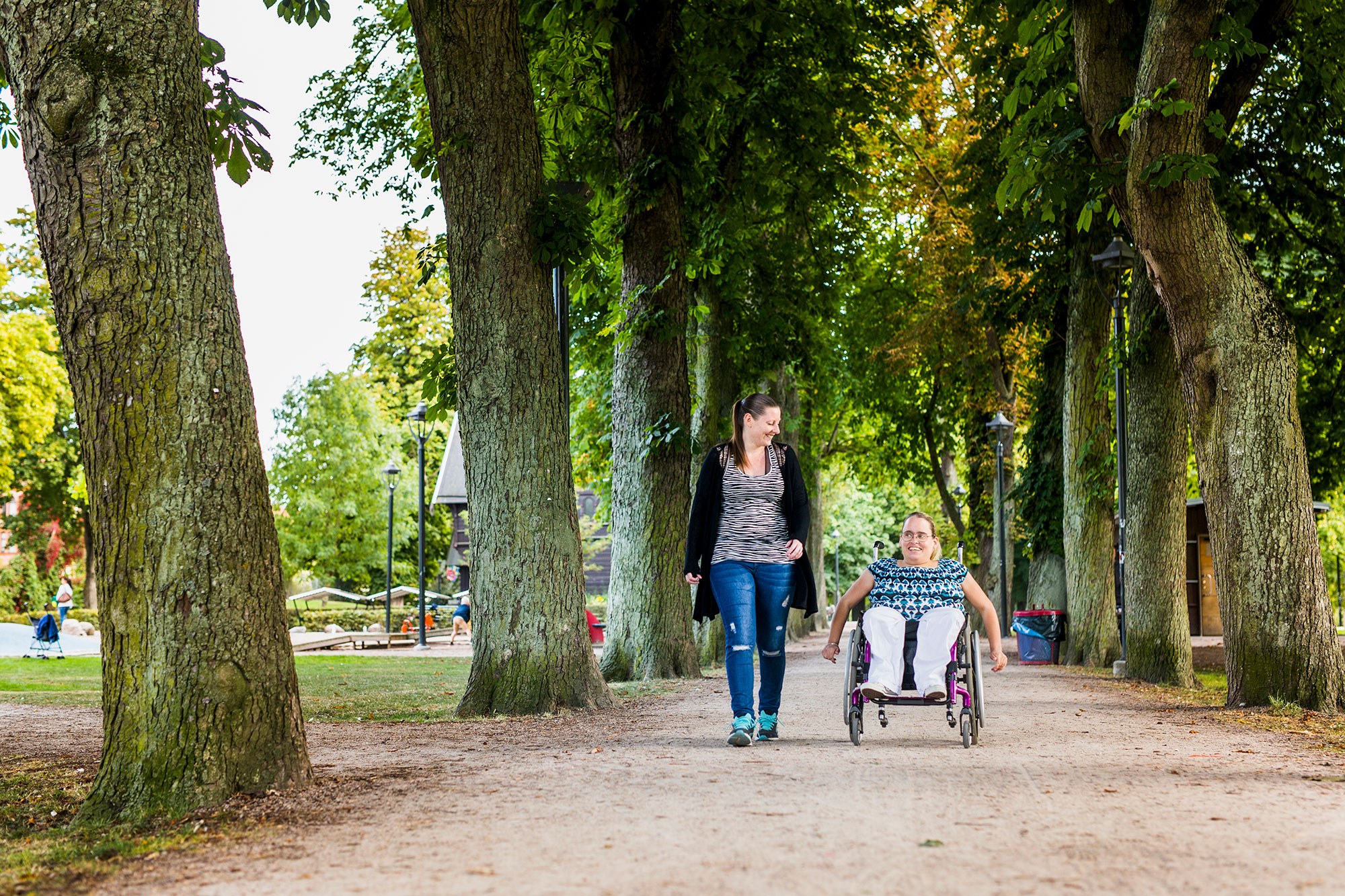 Enable woman in wheelchair with assistant in par 2021 08 29 00 00 00 utc